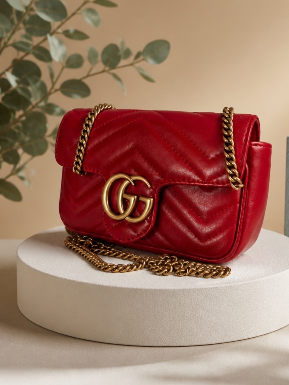 Gucci Red Leather Mini Marmot Crossbody Bag.